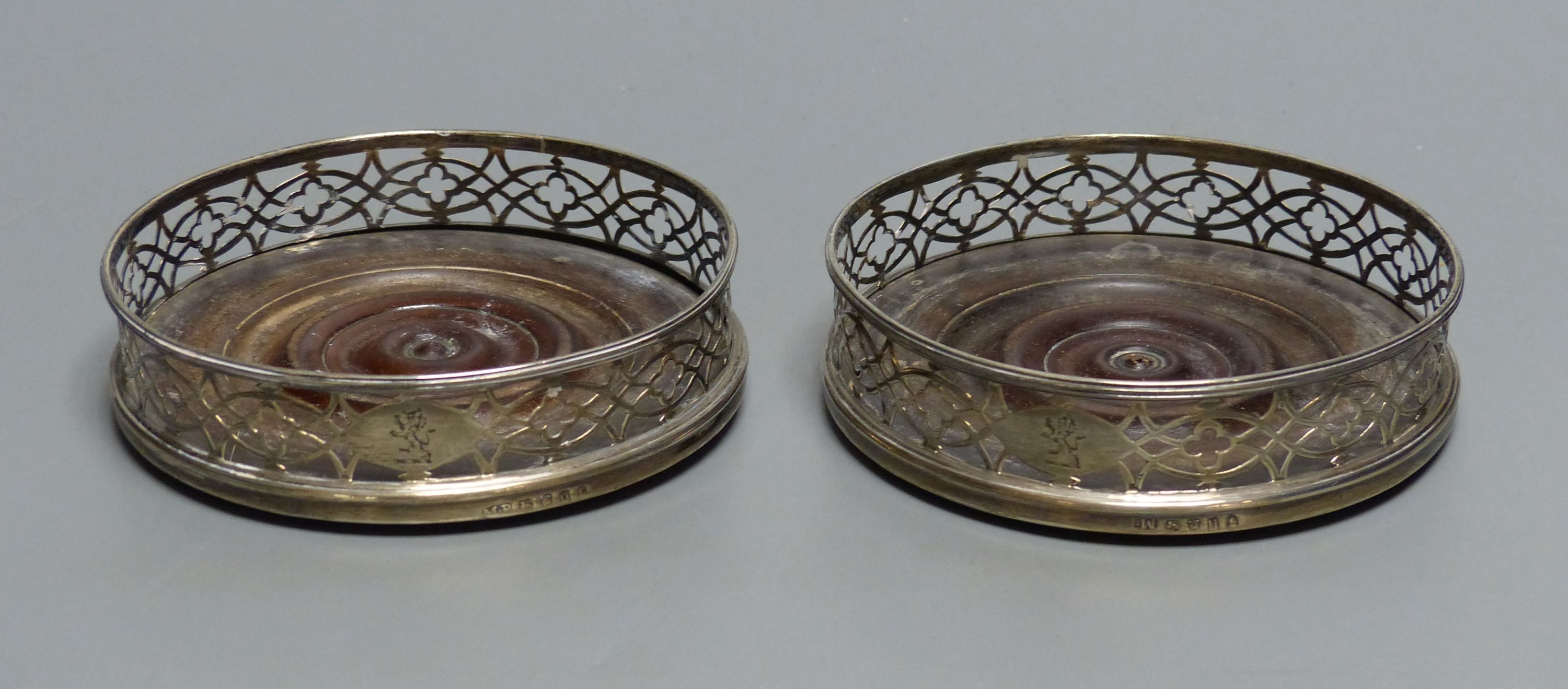 A pair of George III silver bottle coasters Dia 12.5cm